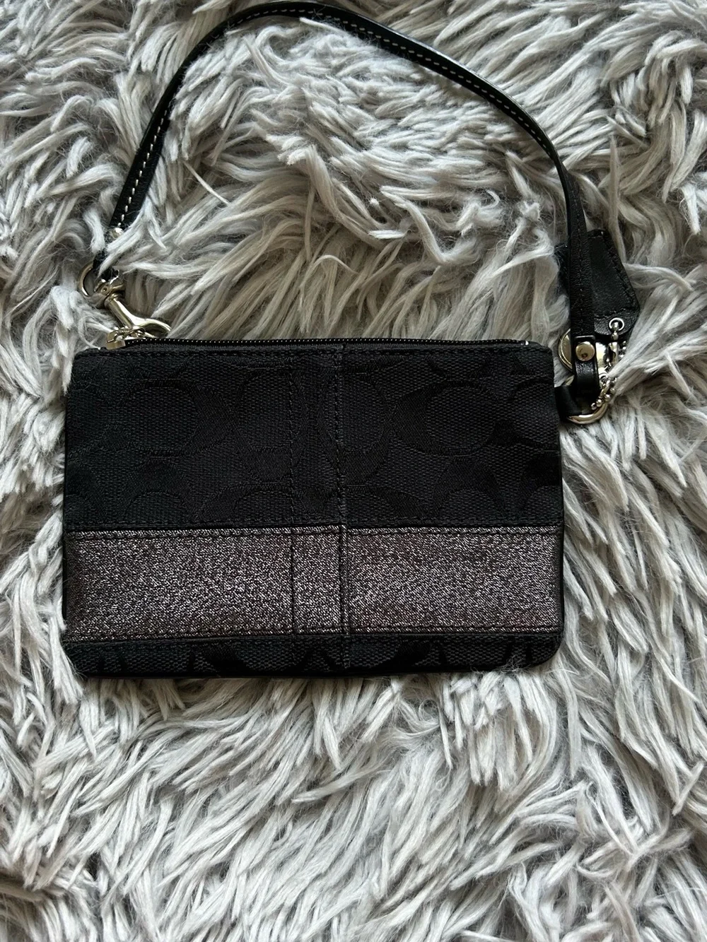 Coach wristlet featuring